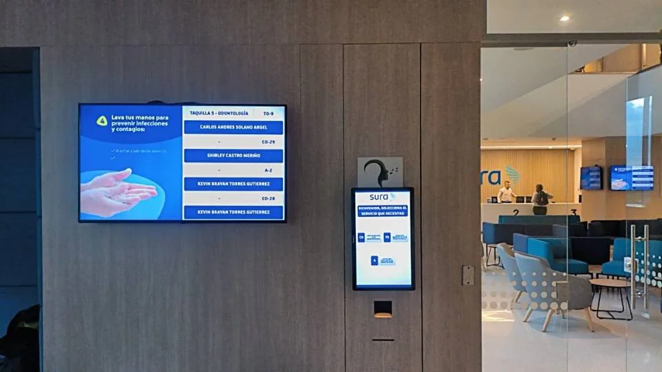 Digital signage integration with health tips and a wall-mounted kiosk to speed up patient reception